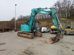 Picture of the Kobelco SK140SRLC-3 with 3 buckets