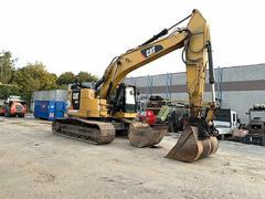 Picture of the Caterpillar 335F L with 2 buckets